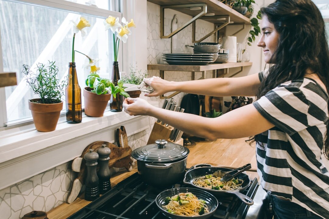 Portrait of a Czech woman writing recipes in a home kitchen