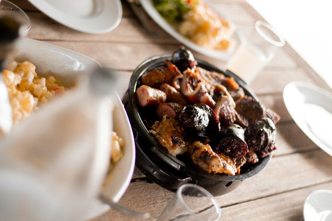 Traditional Czech Sunday lunch table with roast meat and dumplings